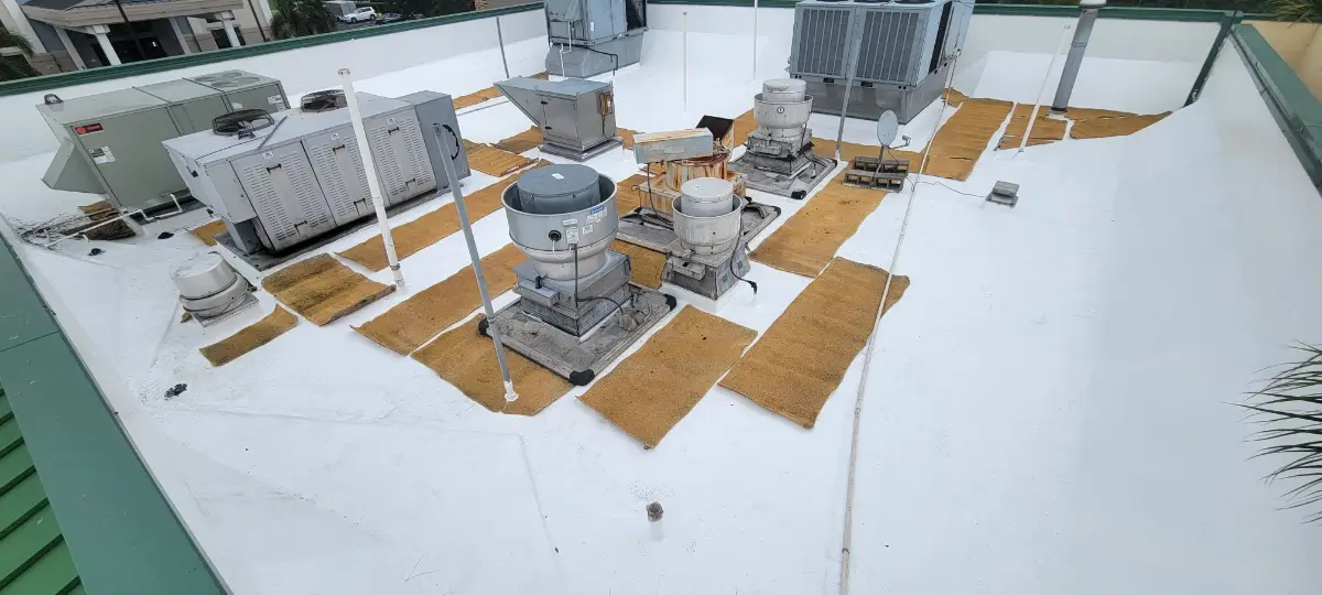 commercial-roof-coating-restoration-pa Commercial flat roof with protective roof coating and rooftop HVAC units after restoration